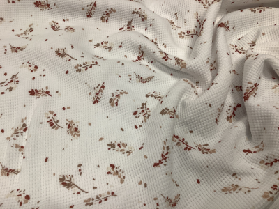 Tricot waffle white met terra kleurige blaadjes
